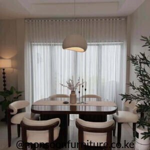 Dark rounded 6 seater dining set Kenya with cream upholstered chairs and twin pedestal table base