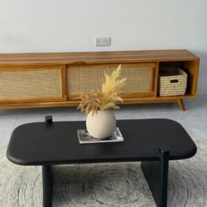 Matte black rounded coffee table Kenya with a thick rectangular top, broad panel legs and small raised corner posts.