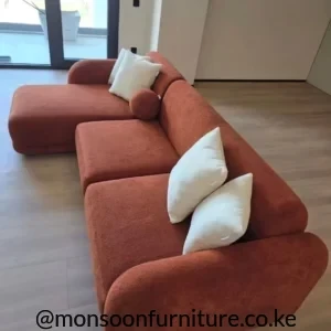 Terracotta curved modular L shape sofa with chaise for modern living rooms in Kenya