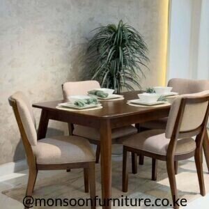 Walnut 4 seater solid hardwood dining set with upholstered beige chairs for modern homes in Kenya.