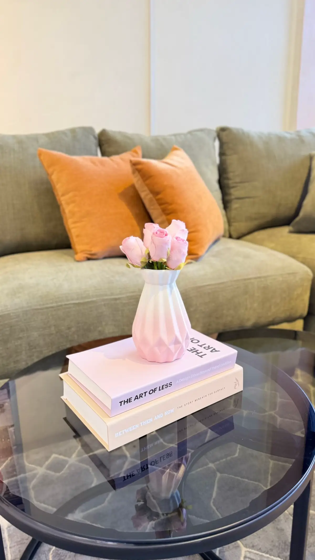 Coffee table styled with a round tray holding candles and a small vase — Kenyan living room