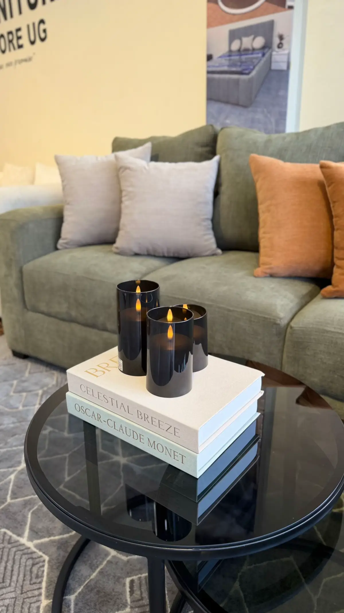Stacked coffee table books topped with a small decorative object — neutral styling