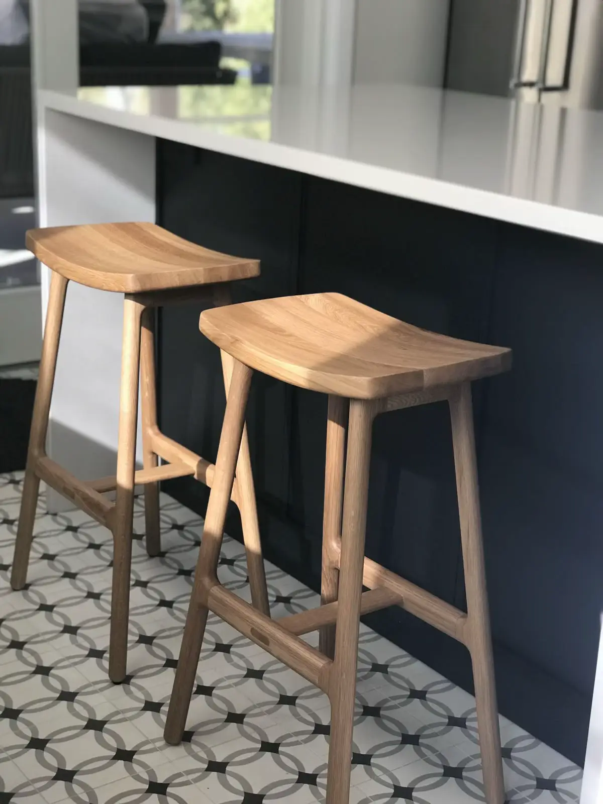 Bar stools at correct height against a kitchen counter showing legroom