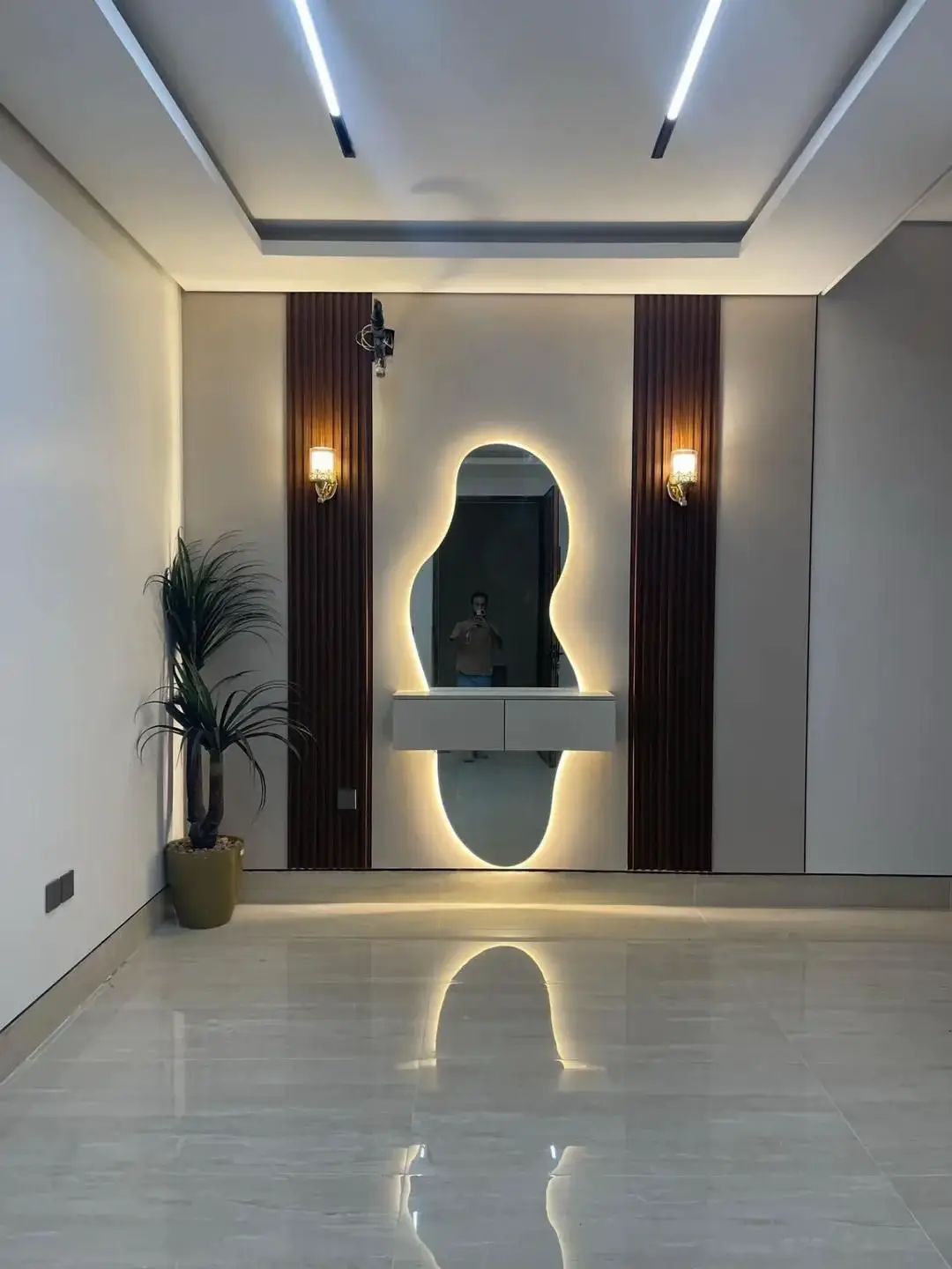 Arched wall mirror adding height to a living room wall in a Nairobi apartment
