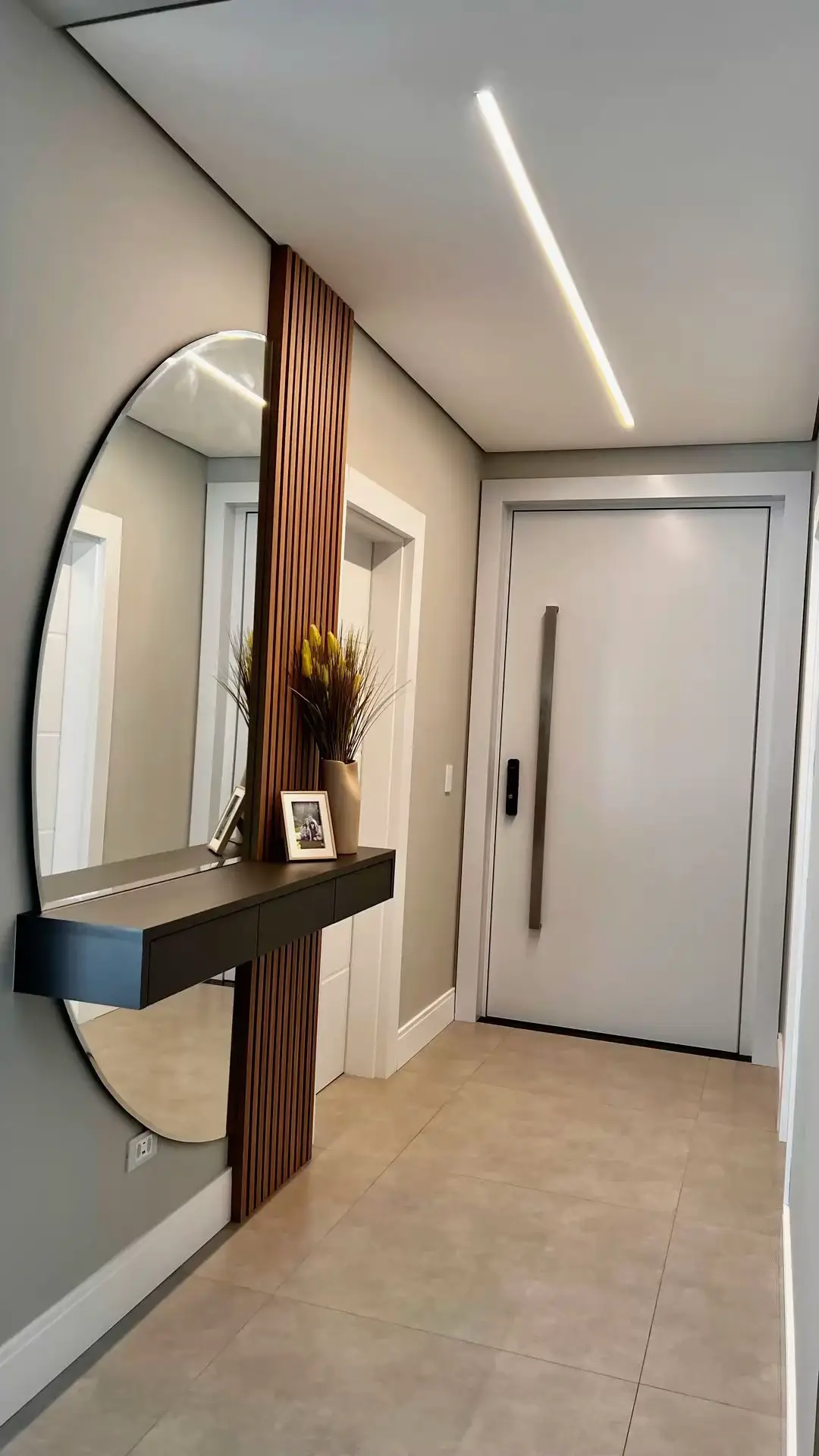 Irregular organic-shaped wall mirror used as sculptural art in a modern Kenyan living room