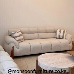 Cream wood-accent 7 seater sofa set Kenya in a 4+3 lounge arrangement with rounded arms and channelled upholstery.