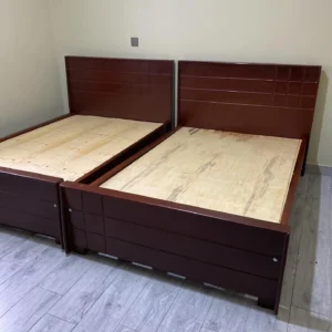 Two 4×6 dark brown bed frames with wide panelled headboards and matching footboards.