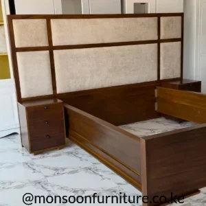 Dark brown 5×6 bed frame with an extra-wide headboard featuring six beige fabric-look inset panels.