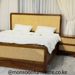 5×6 woven panel bed with warm brown frame, tall light woven headboard, matching footboard and white bedding in a bedroom