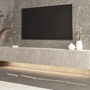 6ft beige fluted floating TV console with warm under-cabinet lighting below a wall-mounted television
