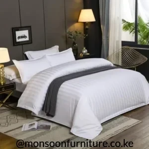 White 6×6 striped duvet cover on a made-up bed with subtle tonal stripes and white pillows