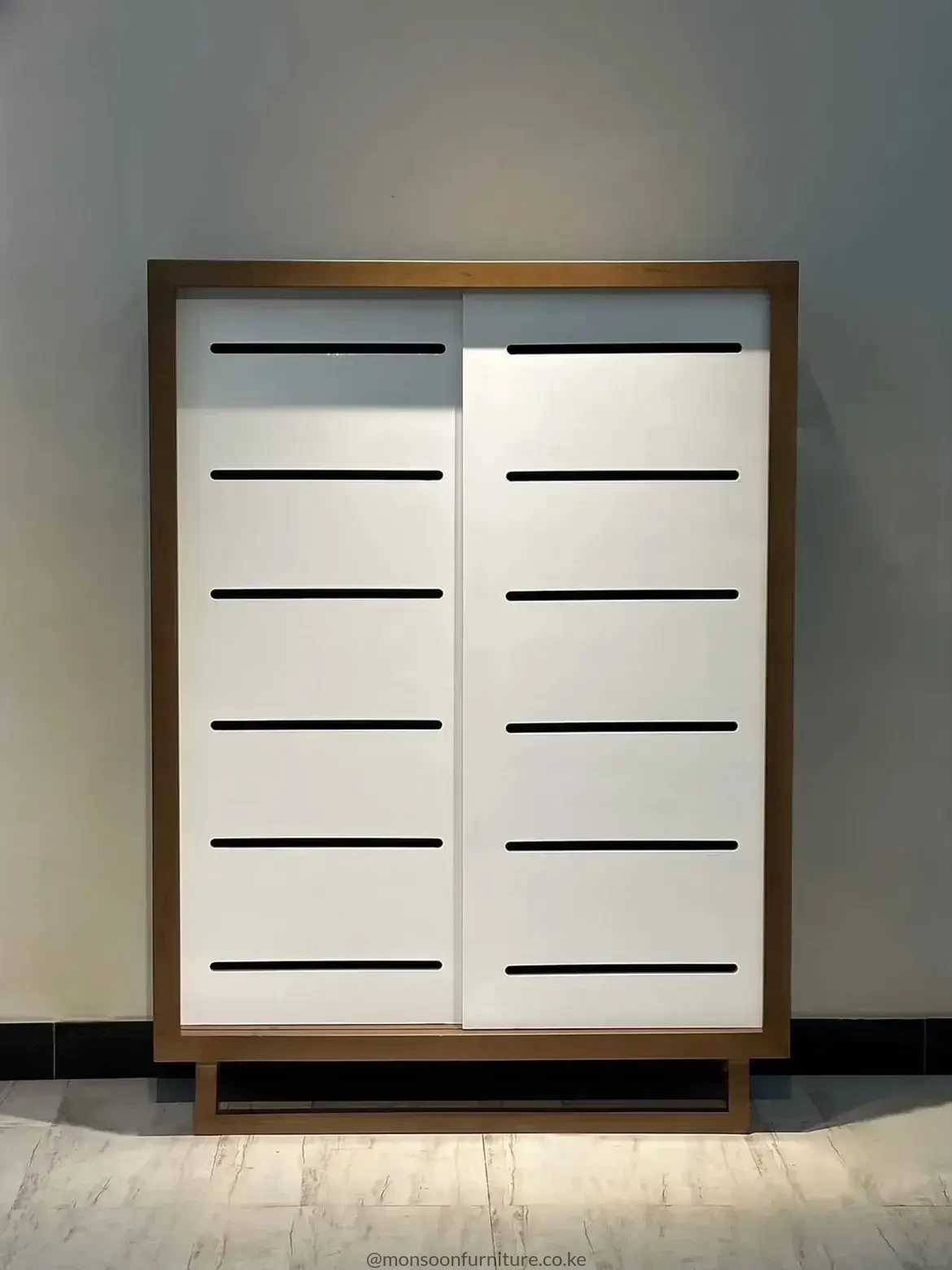 Shoe cabinet front panel with horizontal airflow slots for ventilated storage