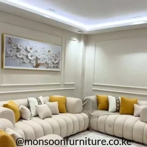 Cream 3-2-1 sofa set with rounded upholstered arms, curved backs and vertical channel detailing in a modern living room