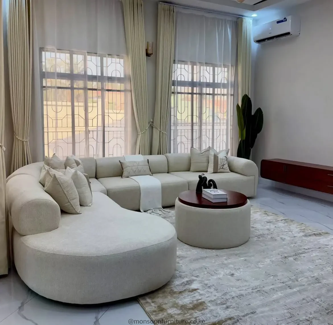 Cream curved modular bouclé lounge sofa for modern living rooms in Kenya