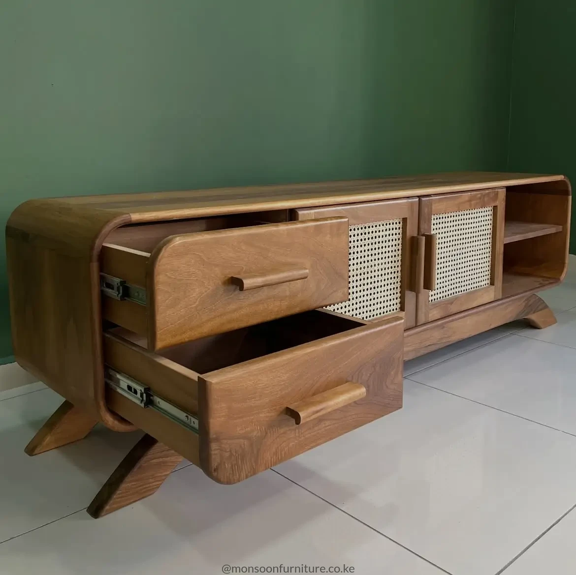 Hazeran 180 cm media console with two drawers, woven-panel doors, open shelves, rounded corners and angled wooden legs.