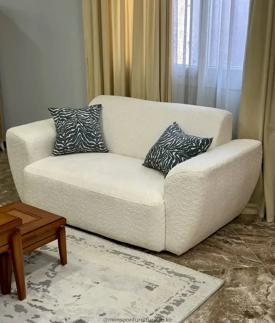 Ivory bouclé 2 seater lounge sofa with deep seating for modern living rooms in Kenya.