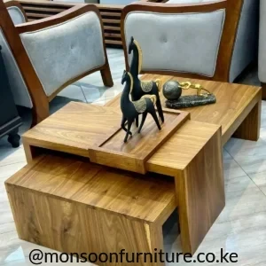 Warm brown nested coffee table set with overlapping rectangular surfaces, a lower tucked-in section and raised centre platform.