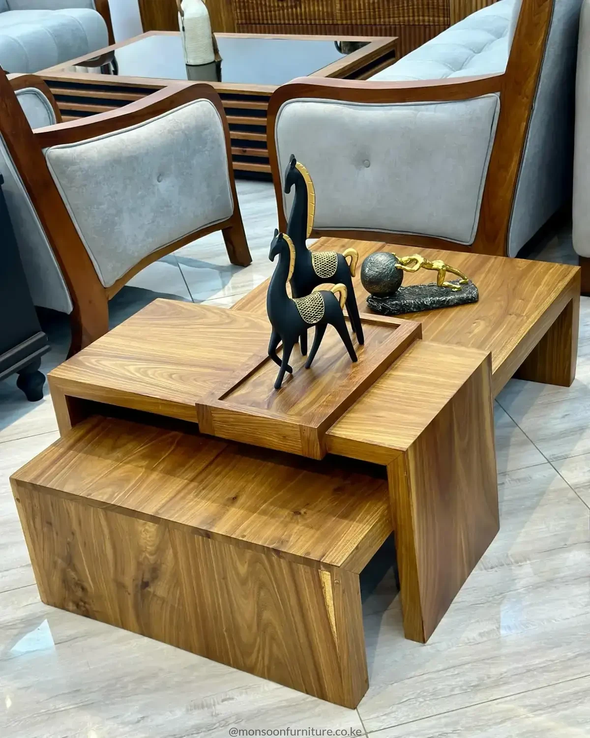 Warm brown nested coffee table set with overlapping rectangular surfaces, a lower tucked-in section and raised centre platform.