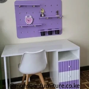 Purple and white study desk with three drawers, open cubby and matching wall organizer with shelves and hanging cups.