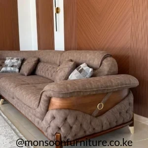 Taupe tufted corner sofa with seven cushions in a living room