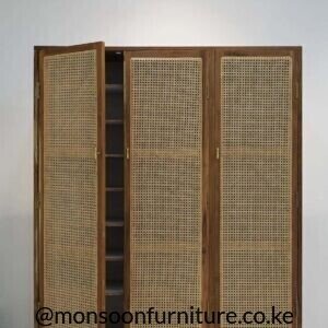 Brown three-door teak shoe cabinet with tall woven panels, brass-tone handles and internal shelving visible behind one open door.