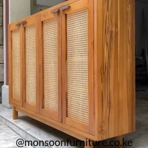 Warm wood-coloured shoe cabinet with three tall woven door sections and raised legs