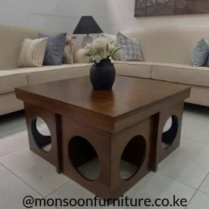 Walnut-look fluted coffee table with rounded corners, dark legs and enclosed body in a contemporary living room