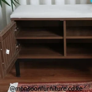 Brown shoe storage bench with light cushion, hinged grooved door, internal shelves and divided compartments.