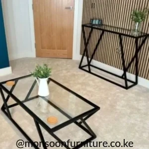 Matching black geometric table pair with rectangular clear glass centre table and slim wall table.