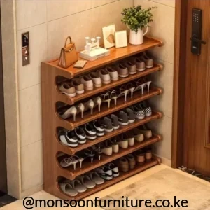 Brown 6-tier open shoe rack with six footwear shelves and a flat top surface beside an entry door. Title: Brown 6-Tier Open Shoe Rack Kenya
