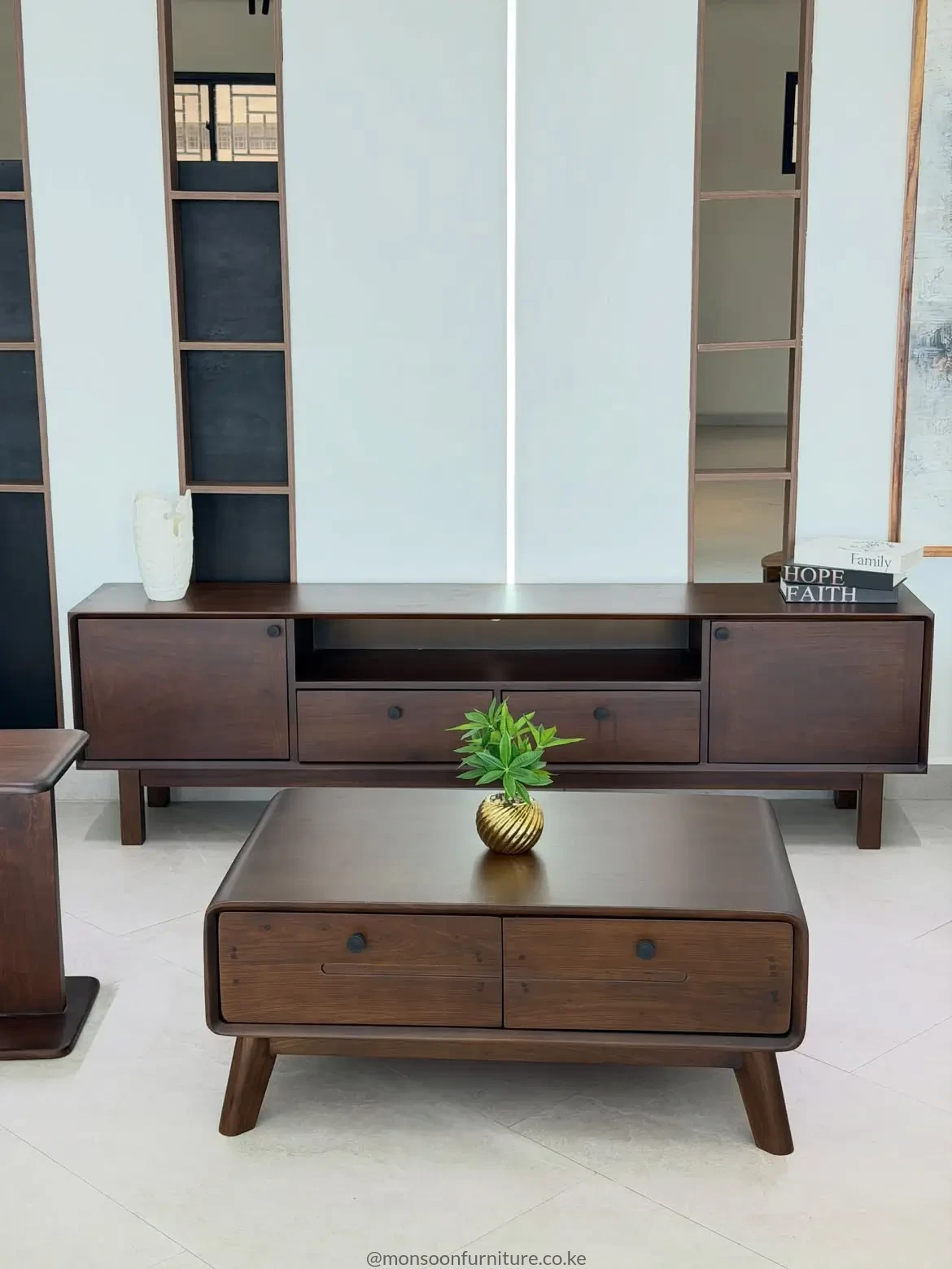 Dark walnut-look TV console and matching rounded drawer coffee table set for a modern living room in Kenya.