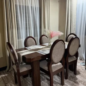 Dark wood 6 seater dining set with rectangular table and six light neutral upholstered oval-back chairs