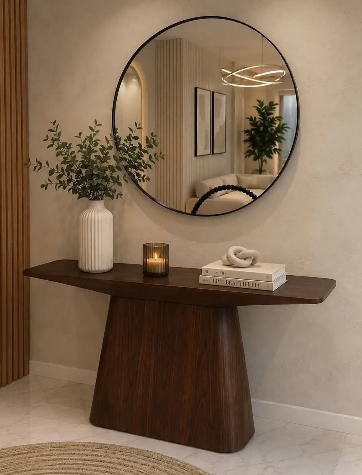 Dark brown curved entryway console beneath a large round black-framed mirror in a modern interior