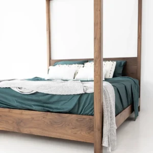 Fetel 6×6 four poster bed with tall brown posts, overhead frame and panel headboard