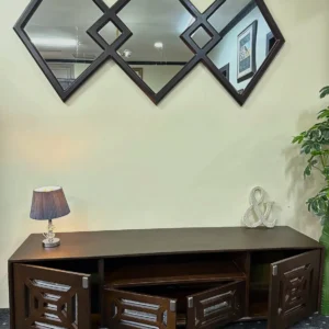 Dark brown geometric TV console with four patterned storage doors and open centre media shelves
