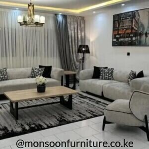 Light grey 4+3+1 sofa suite with dark accents, patterned cushions and matching single chair.