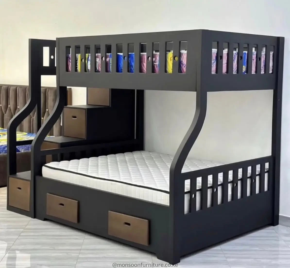 Dark kids double deck bed with integrated study desk, shelves and drawers