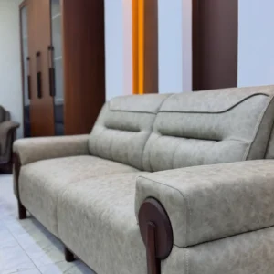 Light grey 5 seater sofa with cushioned backrests, broad arms and dark wood-tone side accents