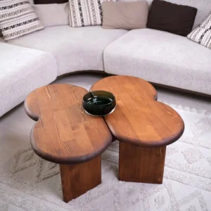 Mahogany clover coffee table with warm brown wood grain and three rounded overlapping tabletop sections