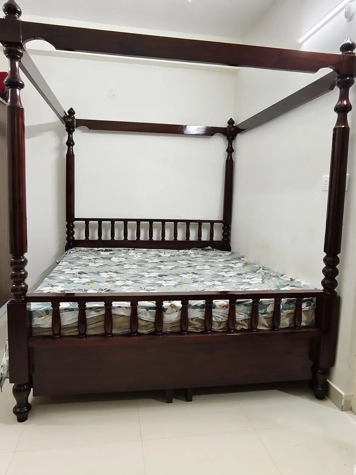 Mango wood four poster bed with tall turned posts, overhead rails and dark-brown finish