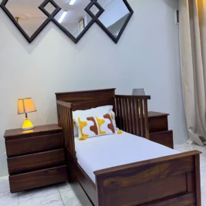 Mninga wood kids bed with dark wooden headboard, footboard and raised slatted side panels