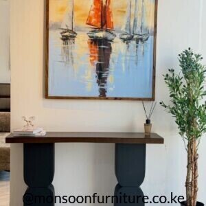 Modern solid Muninga wood entryway console table with sculptural black pedestal legs Kenya