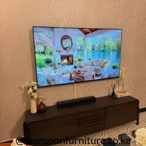 Modern walnut TV stand with rounded corners and sliding doors Kenya