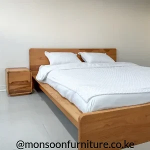 Natural beech wood platform bed with minimalist headboard for modern bedrooms in Kenya.