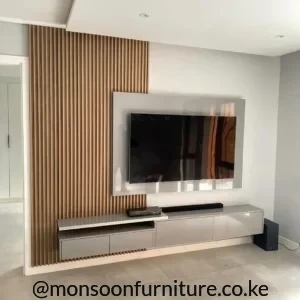 Slatted wood-look TV wall design with grey panel and floating storage cabinet in a modern living room