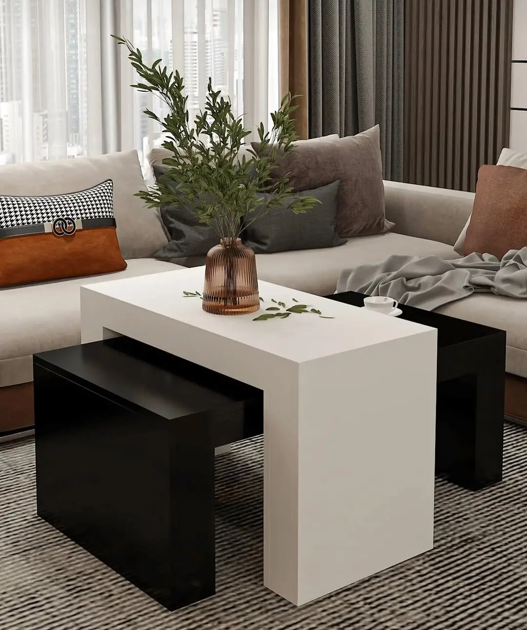 Three-piece nested coffee table set with a white rectangular outer table and two dark brown wood-look tables