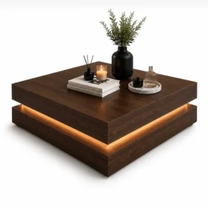 Walnut-look square coffee table with warm recessed accent lighting and layered base