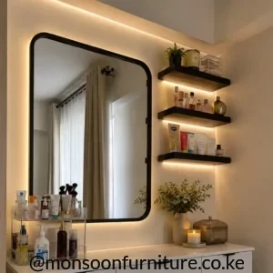 White dressing table with drawer storage, black rounded-corner backlit mirror and black wall shelves