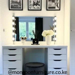 White dressing table with ten drawers and rectangular mirror with illuminated round bulbs