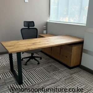 Wood-grain executive office desk with black frame legs and right-side storage in a professional office